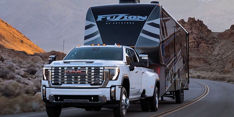White 2025 GMC Sierra 2500 HD on roads