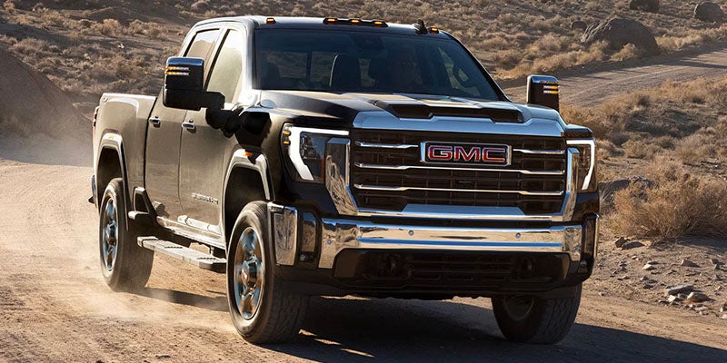 Black 2025 GMC Sierra 2500 HD running on roads