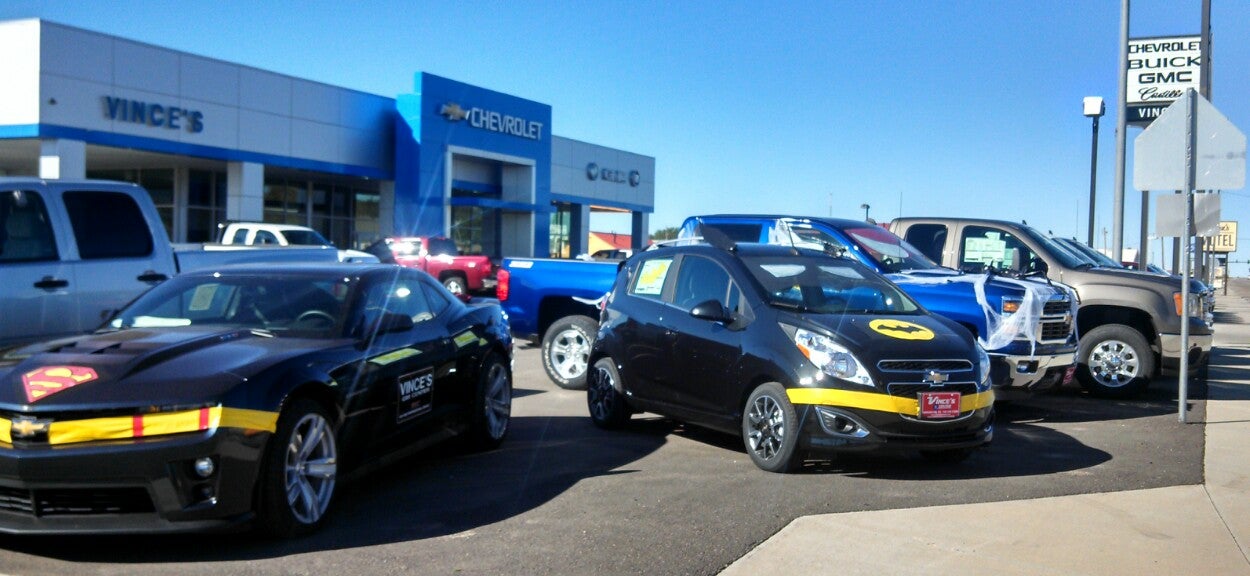 Cars with Batman decals outside of Vince's GM