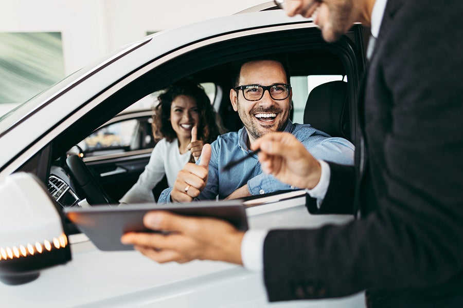 Couple test driving a car